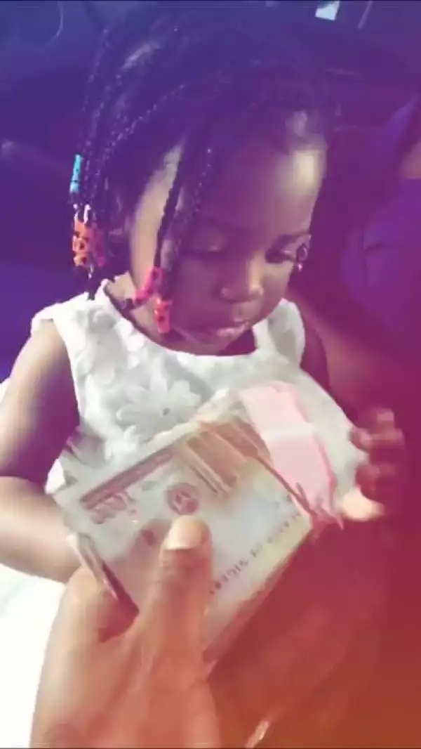 Davido Gifts His Daughter Imade Naira Notes & Flowers As Valentine Gift (Photos/Video)
